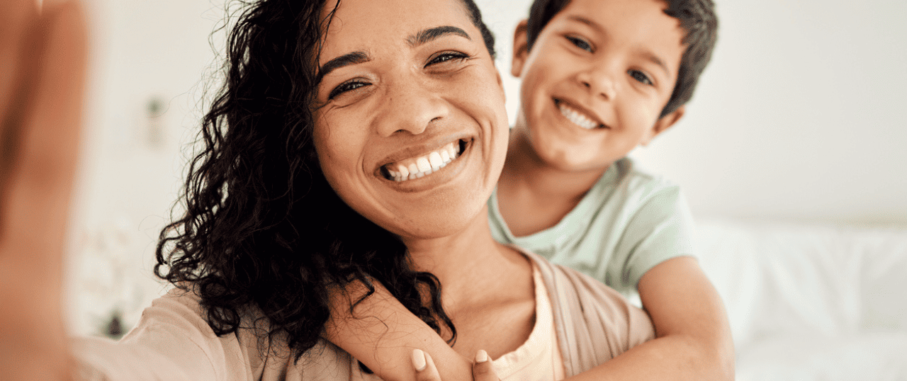 financial assistance mother and son smiling